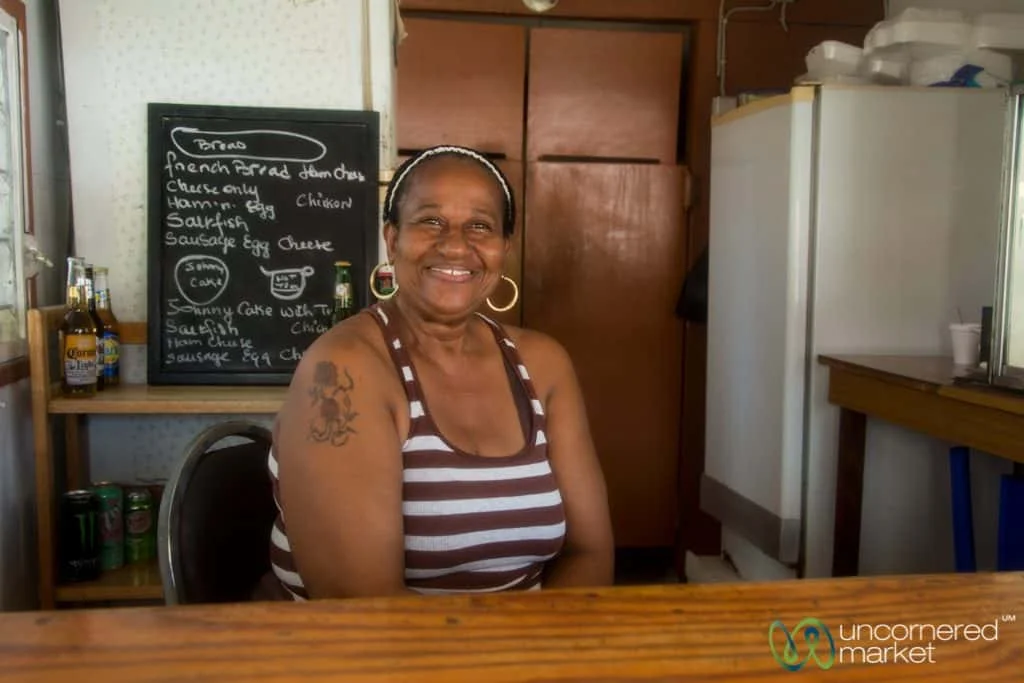 The always smiling Hilma of Windsor Castle food stand in Simpson Bay.